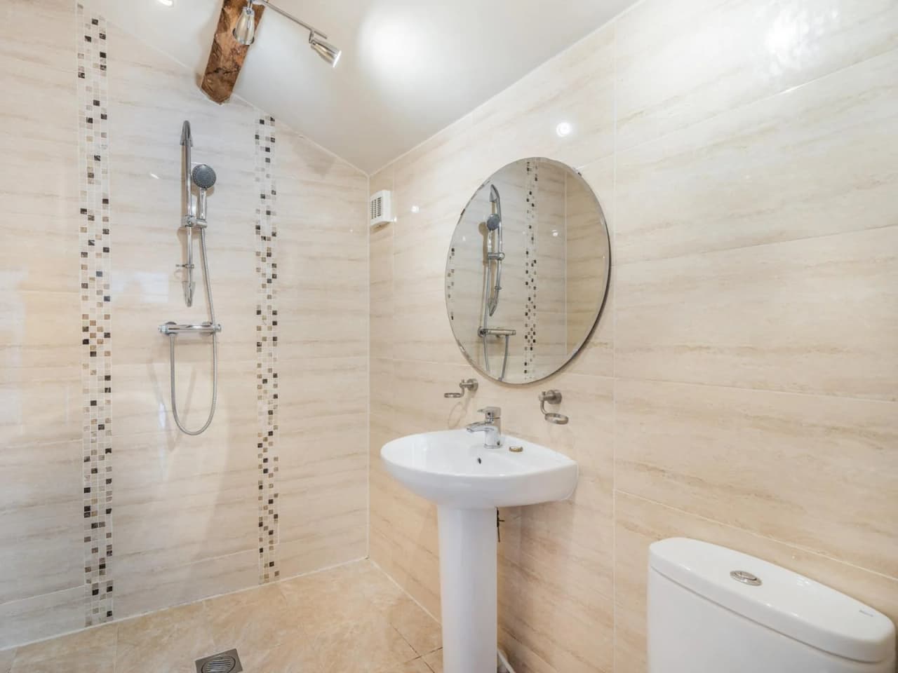 The downstairs bathroom and wet room with open shower